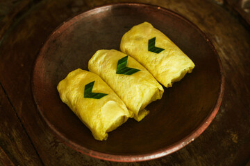 Traditional snack from indonesia called Semar Mendem, made from sticky rice, chicken and eggs