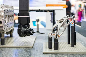 automatic coordinate measurement machine (CMM) during inspection automotive or motorcycle industrial part in quality control manufacturing process