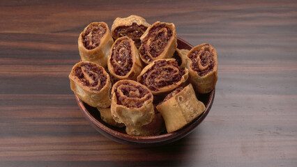 Indian traditional Snacks Bhakarvadi or Bakarvadi.Diwali snacks Bhakarwadi, selective focus