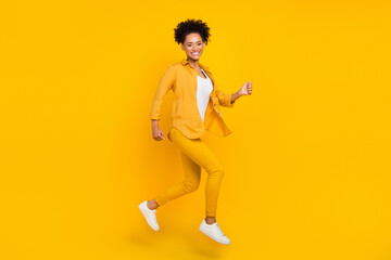 Fototapeta na wymiar Full length body size photo woman jumping up running on sale isolated vibrant yellow color background