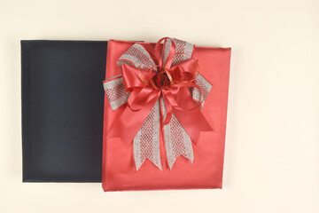 Gift box on orange space. Present for birthday, valentine day, Christmas, New Year concept.