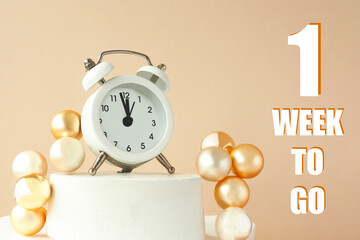white alarm clock on a stand, 3D balls and the inscription 1 week to go.