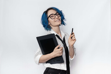 A female designer in office style look holding graphic tablet