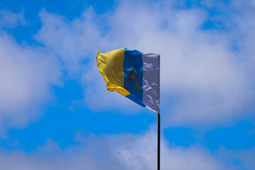 flag,canary islands flag,wind,fluttering,sky,clouds