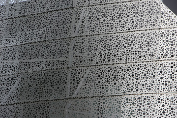 Metal surface with perforations for background