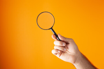 man holding a magnifying glass