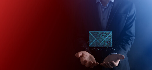 Businessman hand holding letter icon,email icons.Contact us by newsletter email and protect your...