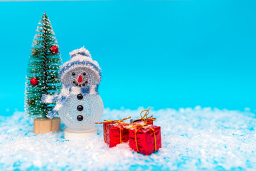 snowman, presents and Christmas tree snow with copy space.new year celebration.