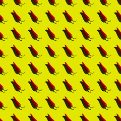 flat seamless pattern of red hot pepper on a yellow background