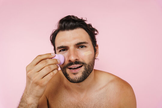 White Shirtless Man Applying Concealer With Sponge