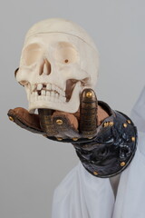 Medieval knightly brown plate gauntlet from Italian armor, in the form of a lion's face and mane,...