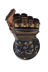 Medieval knightly brown plate gauntlet from Italian armor, in the form of a lion's face and mane,...