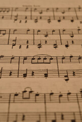 Fototapeta premium sheet music in the foreground with selective focus