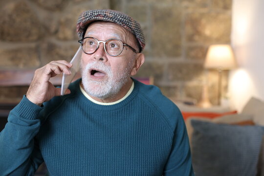 Retired man getting shocking news on the phone