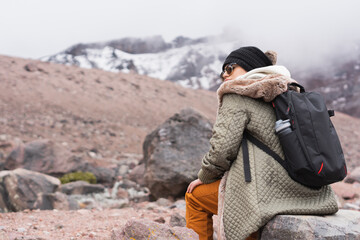 Young woman on an adventure in the mountains.