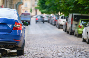 Close up of a car parked on city street side.