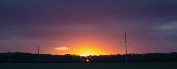 Purple sunset over power lines