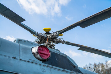 engine and blades of the helicopter against the blue sky