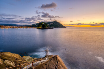 The bay of San Sebastian in Spain with Monte Igueldo at sunset
