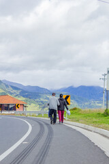 Old couple walking on the road side
