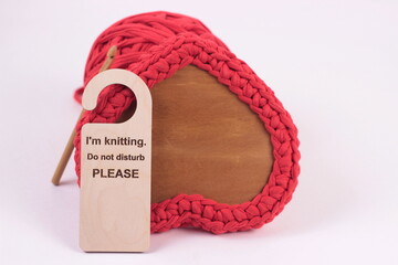 i'm knitting Do not disturb please sign on crocheted red box  background
