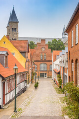 Street with old houses leading to the Domkirke church in Viborg, Denmark