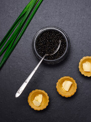 flatley: natural black sturgeon caviar in a glass jar, vintage spoon, shortcrust pastry tartlets...