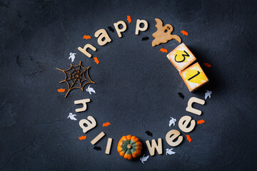 Halloween greeting card with ghosts, spiderweb, pumpkin and bats