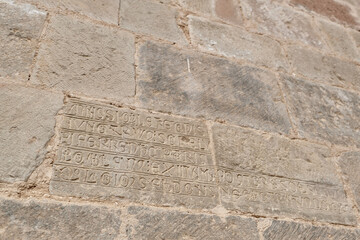 Fototapeta na wymiar Medieval funerary inscriptions carved directly into the walls of the Monastery of San Juan de la Peña, in the Spanish Pyrenees