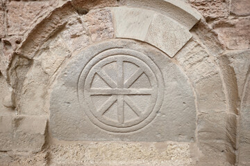 Fototapeta na wymiar San Juan de la Peña, Aragon September 7, 2021, Wheel in a Sepulcher in the Pantheon of the monastery of San Juan de la Peña