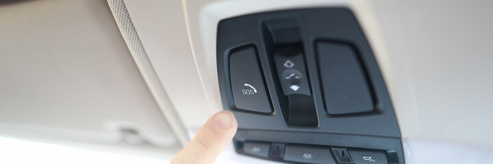 Man finger pressing sos emergency button to contact call center