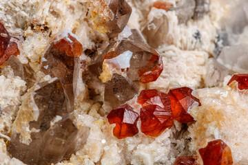 Macro mineral stone Spessartine, Feldspar, Smoky quartz, on a white background