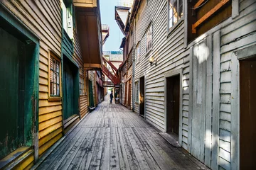 Fotobehang typical wooden buildings in Bryggen district in Bergen, a beautiful city in Norway © VinyLove Foto