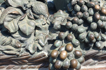 Close-up of the decorative elements of the stone fountain.