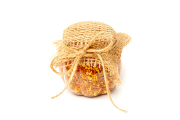 Pollen, beekeeping products on a white background. A beautiful jar with bees collected by bees. copy space