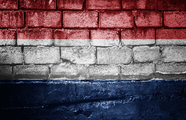 Dark brick wall with the flag