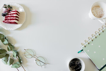 Breakfast composition with red velvet cake and a cup of milk and coffee on white background. Flat lay, top view.