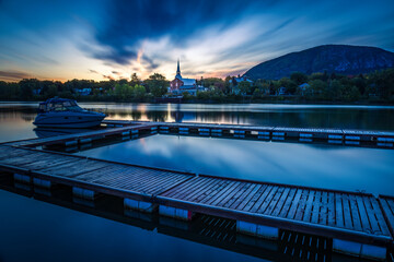 Mont St-Hilaire at sunrise seen from the public marina of Beloeil, with the reflection on the Richelieu River