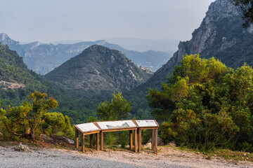 Mountainous landscape, with information panels with information on the mountains and the...