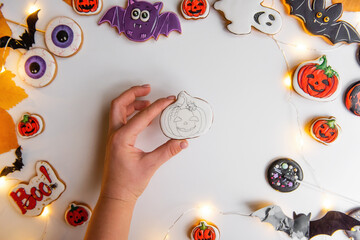 DIY Halloween gingerbread cookie. Step 3, on white base, draw pumpkin counter with pencil.