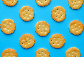 crackers or biscuits arrange on blue background isolated.