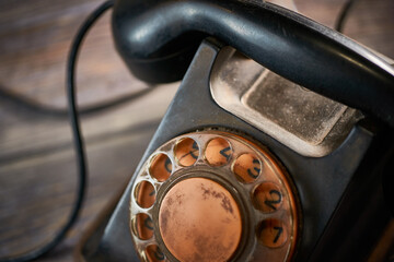 Classic telephone vintage color, dialing or scrolling phone on wooden table