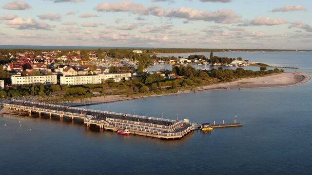 Flying over the pier in Jastarnia on Hel peninsula at the Baltic Sea in Poland