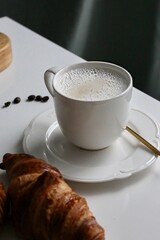 cup of coffee and croissant