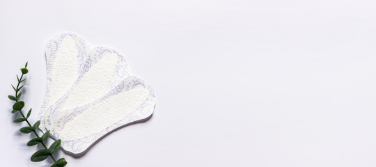 Feminine hygiene panty liner for menstruation. Menstrual cycle, pad. White background.