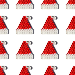 children's toy pop it antitress Santa Claus hat on a white background. Seamless pattern. New Year's and Christmas.