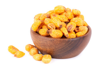 Roasted salted corn nuts in wooden bowl, isolated on white background. Beer snack, dry corn with spices.