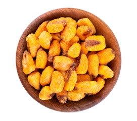 Roasted salted corn nuts in wooden bowl, isolated on white background. Beer snack, dry corn with spices. Top view.