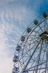 ferris wheel over the blue sky