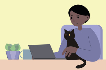 Fototapeta premium An African-American man is working at a laptop, a black cat is interfering with him. Home office, remote work during quarantine and lockdown. Home schooling via the Internet. Online work and study